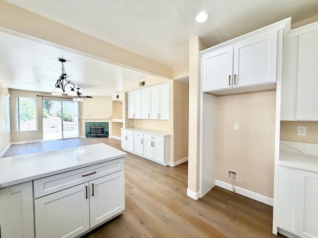 Building Photo - Spacious 5 Bedroom Home with 3 Car Garage & Primary Suite Balcony