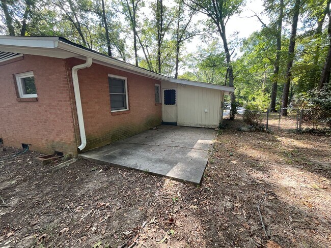 Building Photo - Reduced to $1550/mo! N Central Greensboro location, 3/2 brick home with lots of shade, fresh paint!