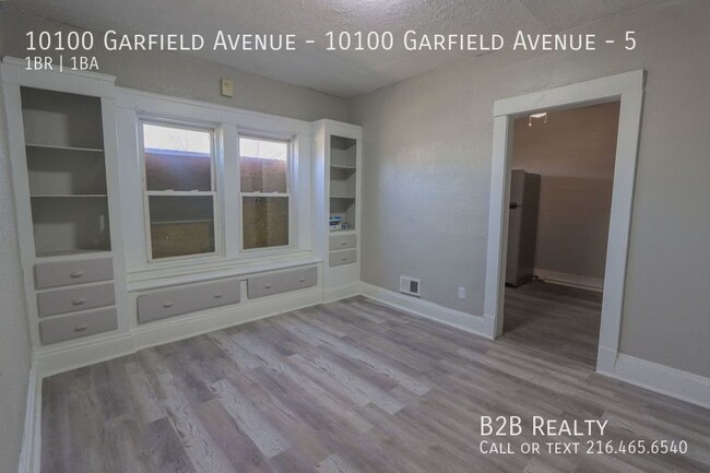 Building Photo - "Charming 1-Bedroom Oasis: Your Perfect Bl...