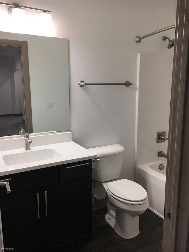 Building Photo - Spacious 4 bedroom/3 bath home with finished lower level and attached 2 car garage