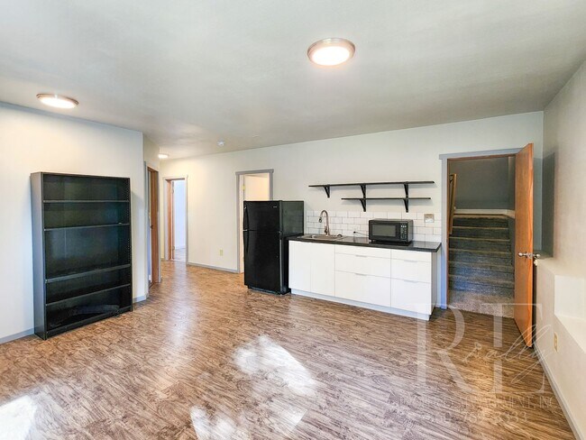 Building Photo - Vaulted Ceilings, Unique Designer Kitchen & Expansive Half-Acre Setting with Flexible Living Spaces