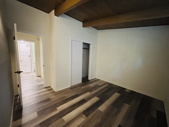 Building Photo - Quirky Mid-Century 3BR with High Beam Ceilings + Fenced Yard – $1,550