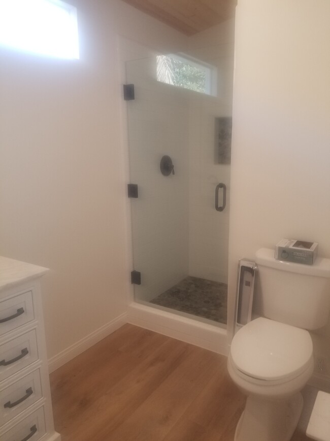 Master on suite bathroom with large stone top vanity and high ceilings - 6832 Zelzah Ave