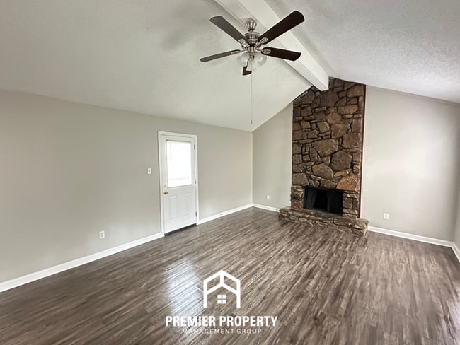 Building Photo - Quiet 3BR/2BA Cove Near Southwind | Soaring Ceilings & Floor-to-Ceiling Stone Fireplace