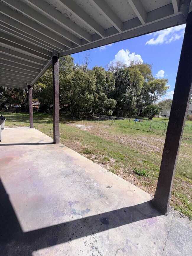 Building Photo - HUGE fenced yard with updated 2 bedroom Home  CALL Sheila to see 407-687-7900