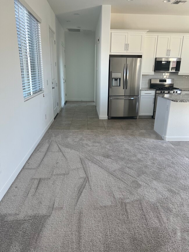 Kitchen/living RM - 3203 N 197th Ln