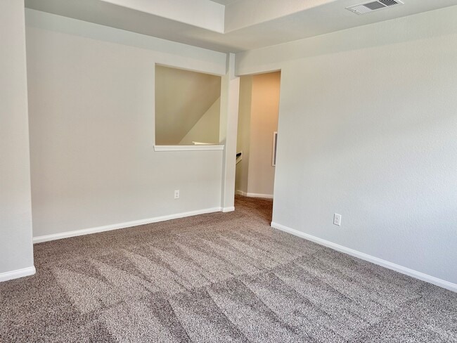 The upstairs gameroom is spacious and perfect for a playroom, craft room or other flex space ideas! - 730 Tejas Village Pky