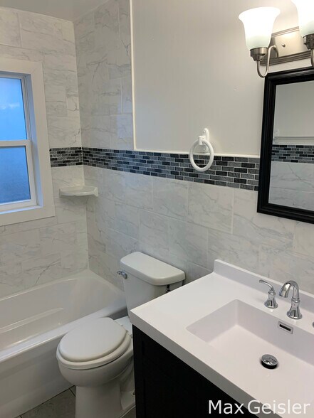 Bathroom with vanity. - 404 12th Ave N