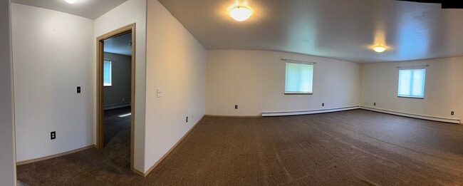 Expansive living room with multiple windows for great natural light. - 2979 Badger Rd
