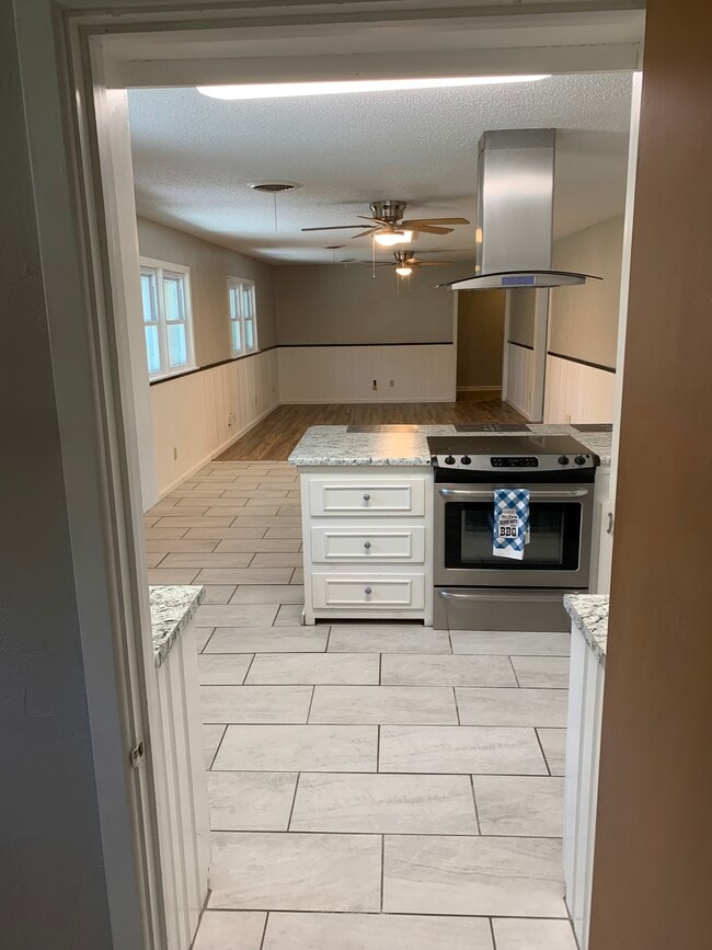 Same shot of kitchen, just standing father back in the laundry room - 4308 Olsen Blvd