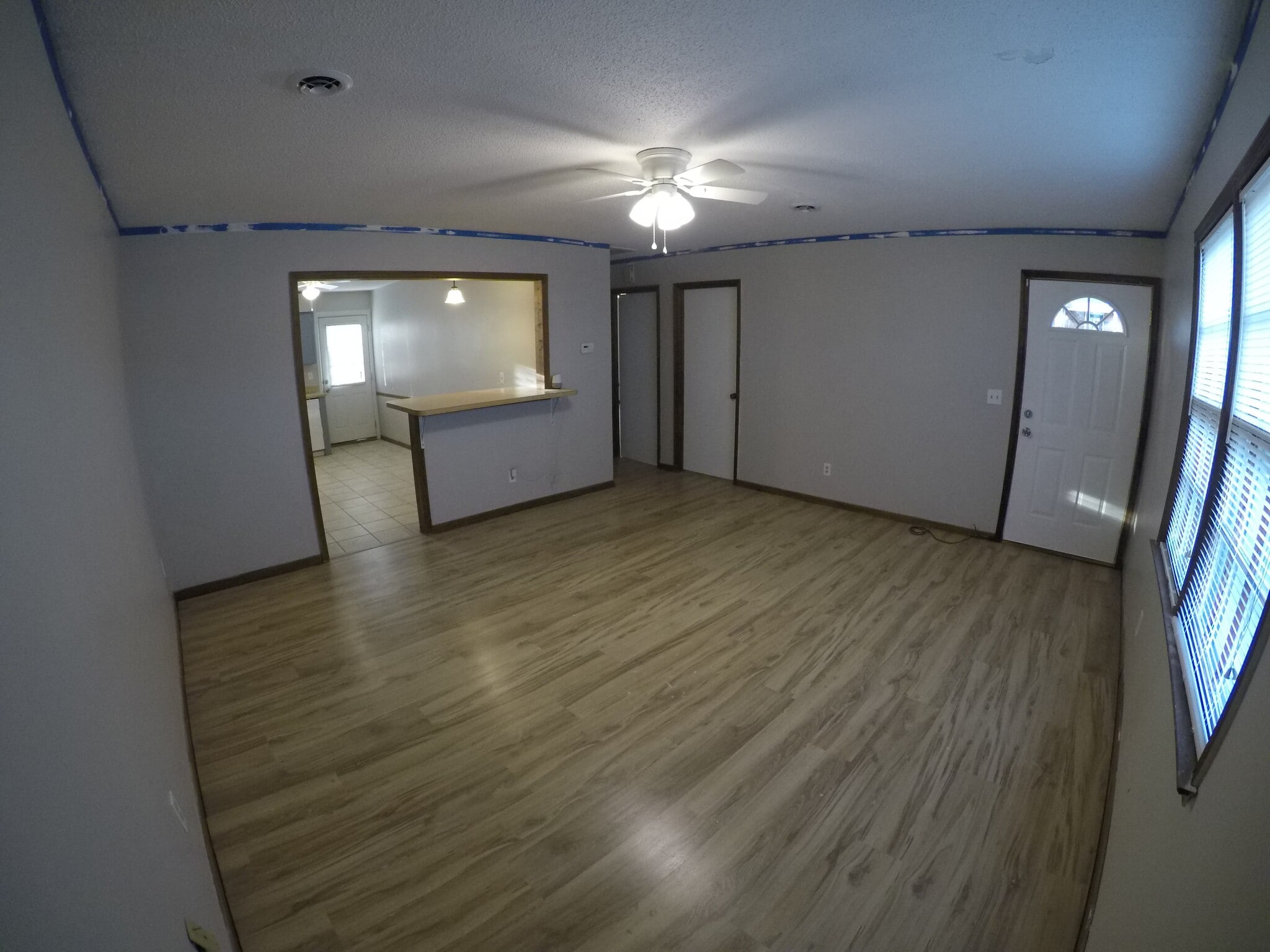 Front Entrance / Living Room (Excuse the blue tape on wall, it was being renovated when pics were taken) - 1536 E Blackstock Rd