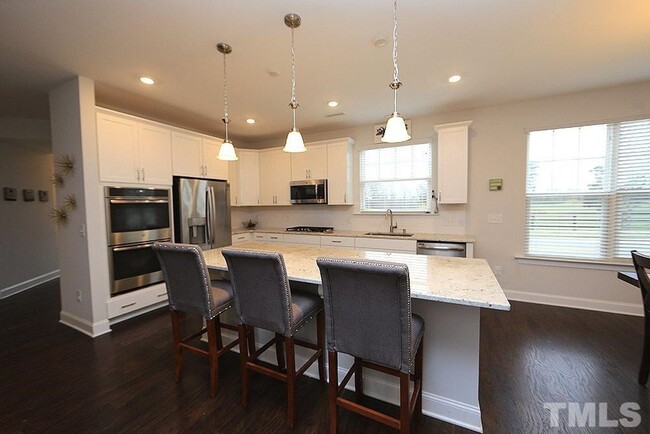Building Photo - Main Floor Owner's Suite PLUS Main Floor G...