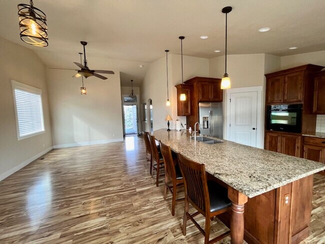 Building Photo - THREE-CAR GARAGE! This charming home offers 3 bedrooms, plus an office/rec room, and 2 bathrooms.