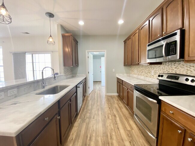 Building Photo - Spacious, Four Bedroom Townhouse With a View!
