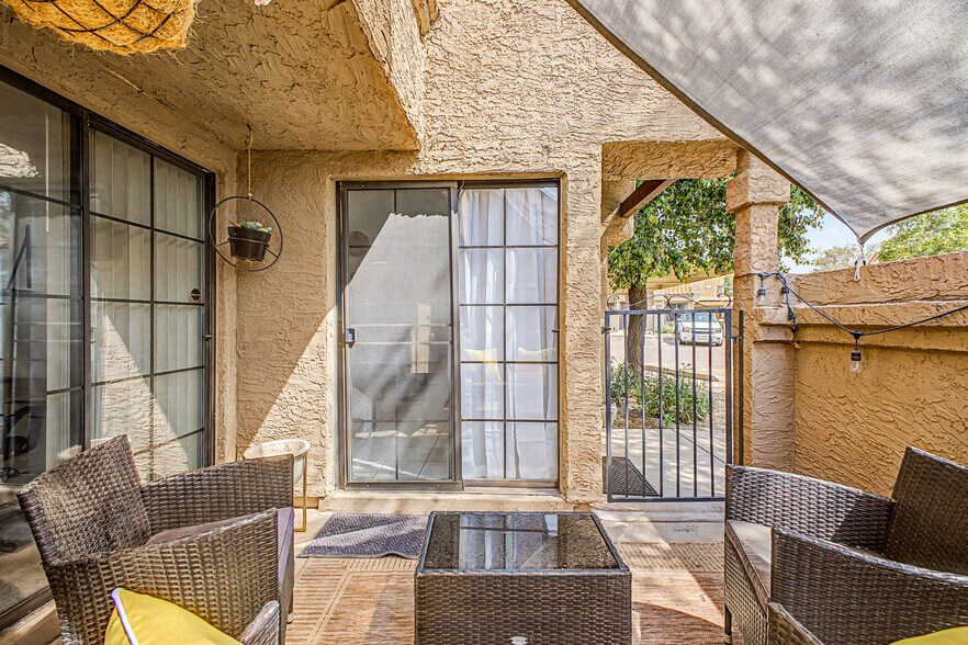 The private patio has a removable canopy so you can relax in soft shade, or full sun. - 819 N College Ave