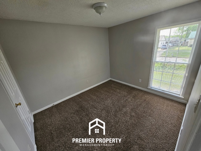 Building Photo - Quiet Cove Living in 38115 | 3BR/2BA with Brick Fireplace & Fenced Yard