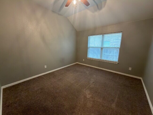 Building Photo - Four bed two bath on a corner lot with a pool in Sunfield. Gas cook top, double ovens. Open kitch...