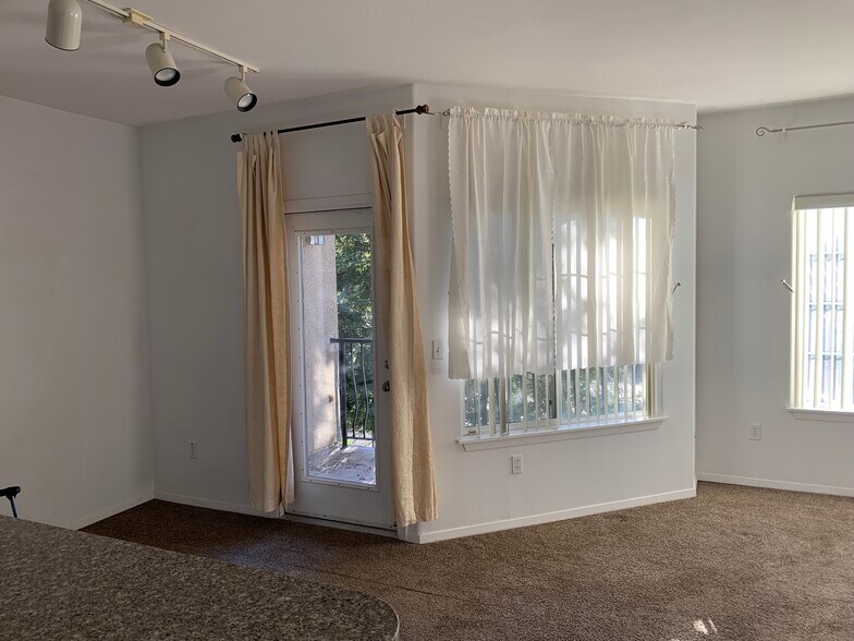 Living room with access to the balcony - 4200 E Commerce Way