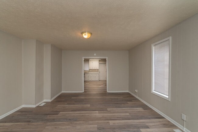 Building Photo - Brick home with a fenced-in yard! Section ...