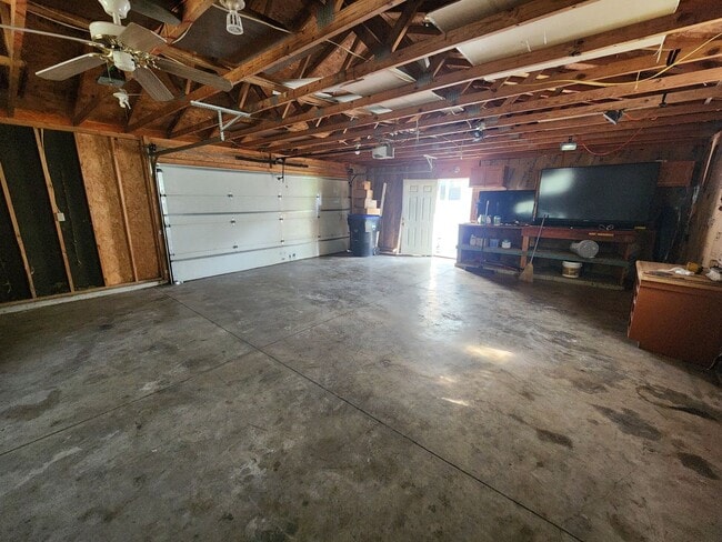 Building Photo - Nice home with oversized 2car gar with work bench and large shaded yard. Country-like setting