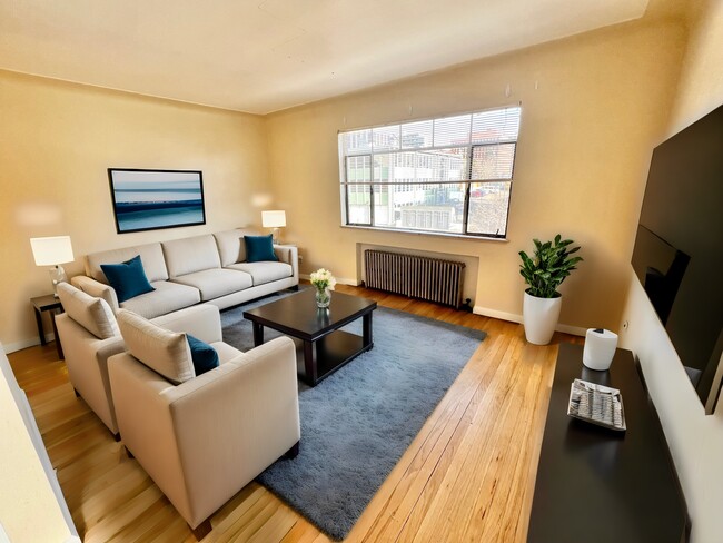 Relax in this bright and welcoming living space, perfect for unwinding or entertaining. - Hillside Apartments