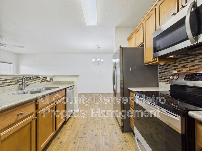Building Photo - 10239 W 55th Dr