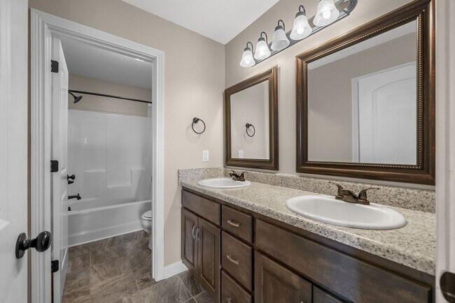 Building Photo - Spacious 4-Bedroom Home with Modern Upgrad...