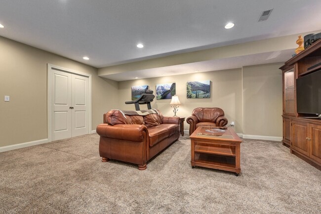 Downstairs media room with plenty of storage behind pocket doors - 532 Beachcliff Row Dr