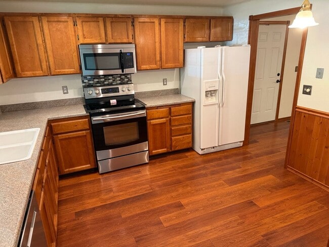 Building Photo - Beautiful 3 Bedroom Ranch Style House with 2 Car Garage, Fences Yard, Fireplace, Shed, Workshop &...