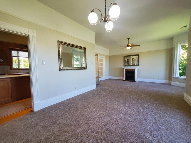 The Dining Room & Living Room has a decorative Ornamental Fireplace - 31 Princess Ln