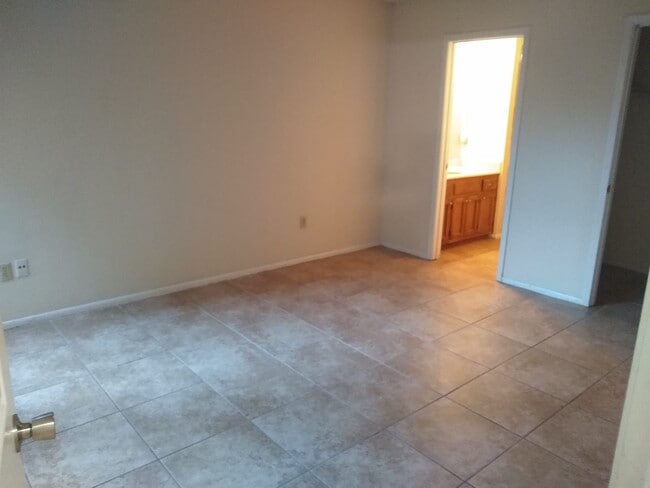 Bedroom 1 with Private Bathroom - 7816 Bles Ave