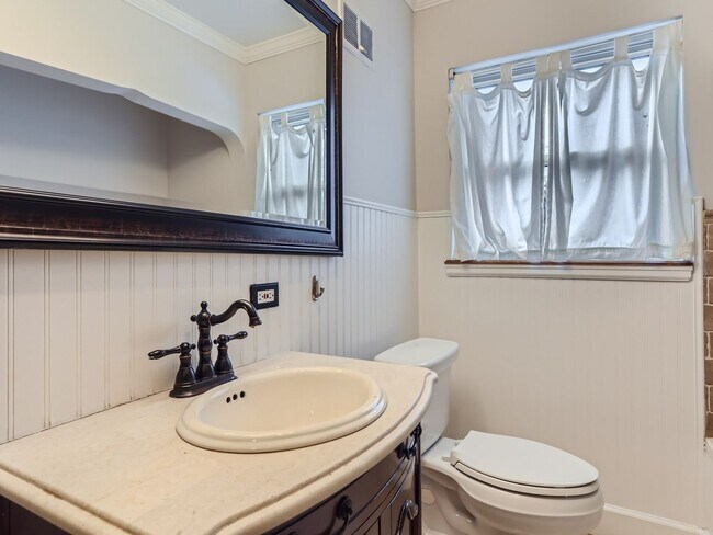 Building Photo - Evolve Real Estate: Available 8/8/26 Brick Tudor with Large Yard and Finished Basement!
