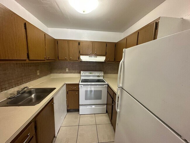 Building Photo - Green Tee - # 202