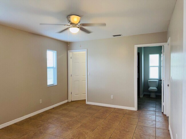 Building Photo - Experience this Cape Coral 3 bedroom 2 bath corner duplex with 1 car garage and screened in lanai.