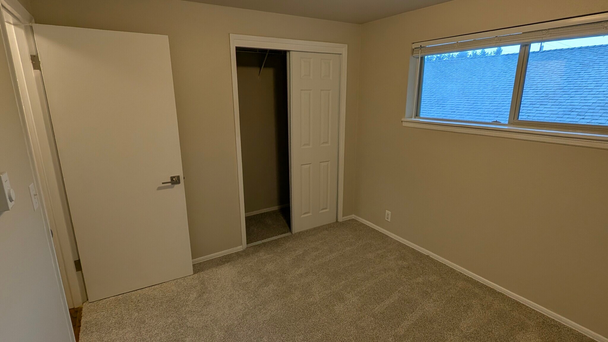 First bedroom with new closet doors - 729 Pecks Dr