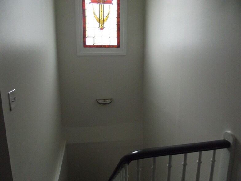 Stairway with stain glass - 906 E Chestnut St