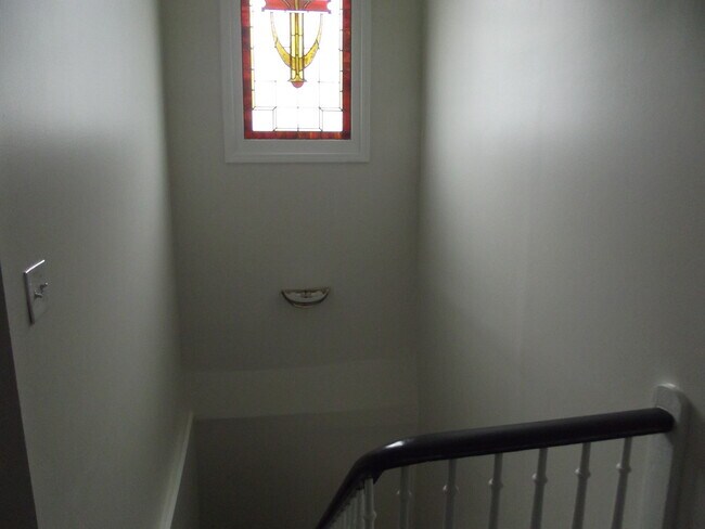 Stairway with stain glass - 906 E Chestnut St