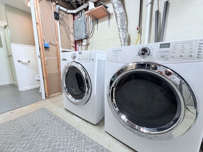 Building Photo - Spacious 4-Bedroom Home with Pond Views & EV-Ready Garage – Bloomington!!