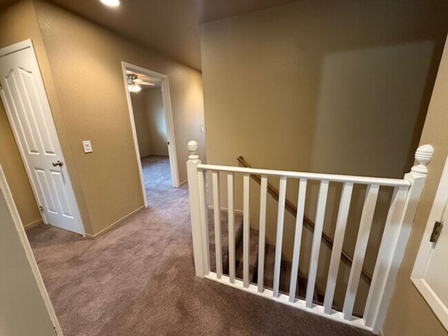 Building Photo - Private Redwood Setting | 4BR Home with Family Room, Bar & Garage Workspace - Available Now