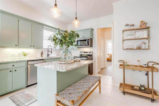 Building Photo - Charming 2-Bed, 2-Bath Gem with Granite Co...