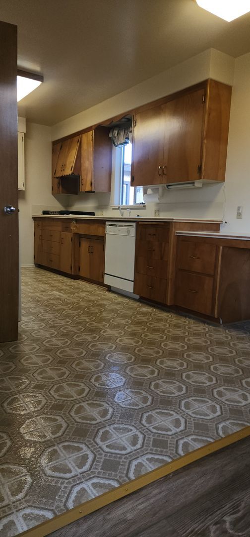 Building Photo - This is a spacious house featuring four bedrooms and two bathrooms, along with a two-car garage.