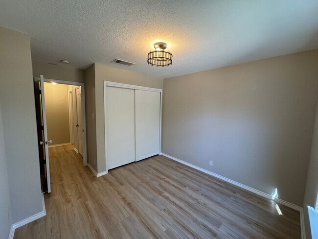 Building Photo - NEW PAINT, FLOORING, APPLIANCES & ROOF  | ...