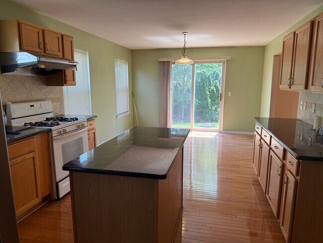 Building Photo - Large 2 Story home with 3 Bedrooms, 2.5 baths, hardwood floors, office and finished basement