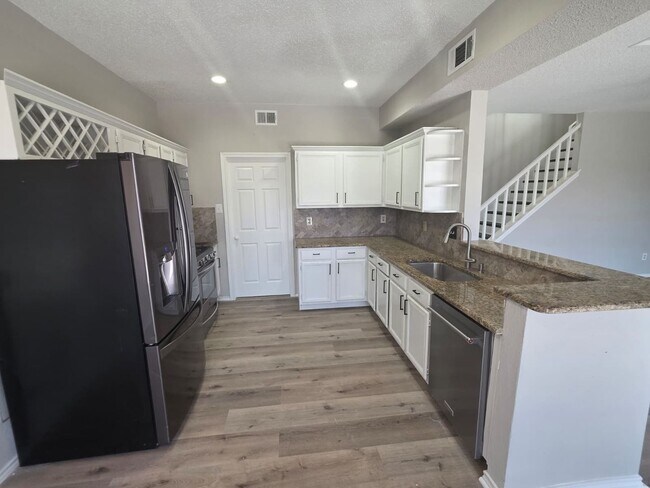 Building Photo - Spacious 4-Bedroom Home with Pool & Spa in...