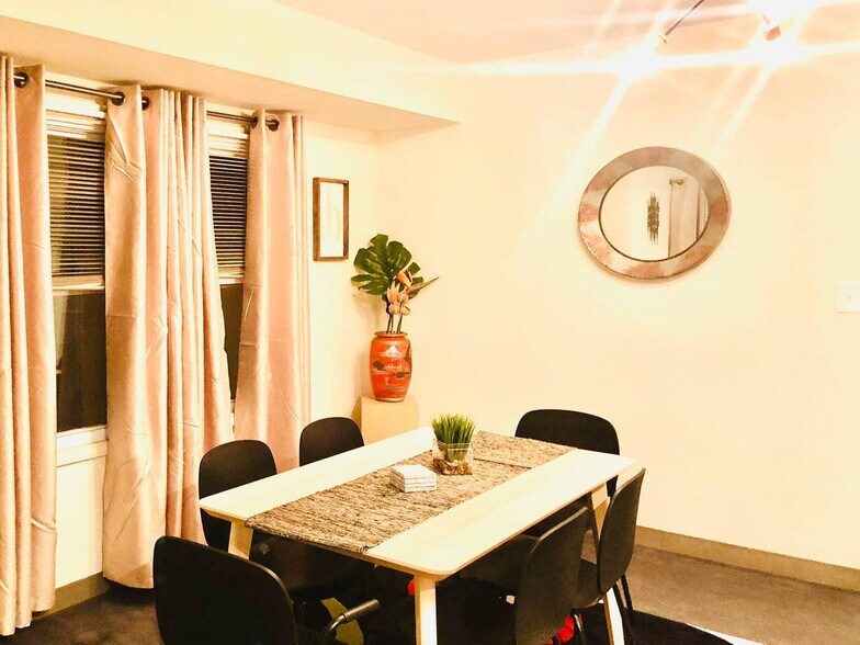 Stylish dining table can accommodate up to 6 people - 621 W 43rd St