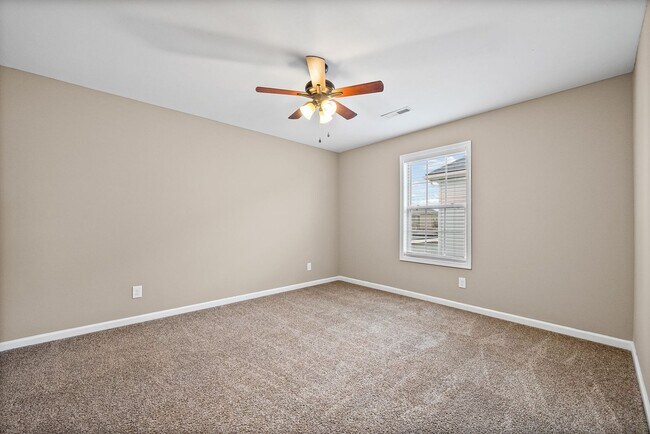 Building Photo - Four Bedroom with Three Car Garage!