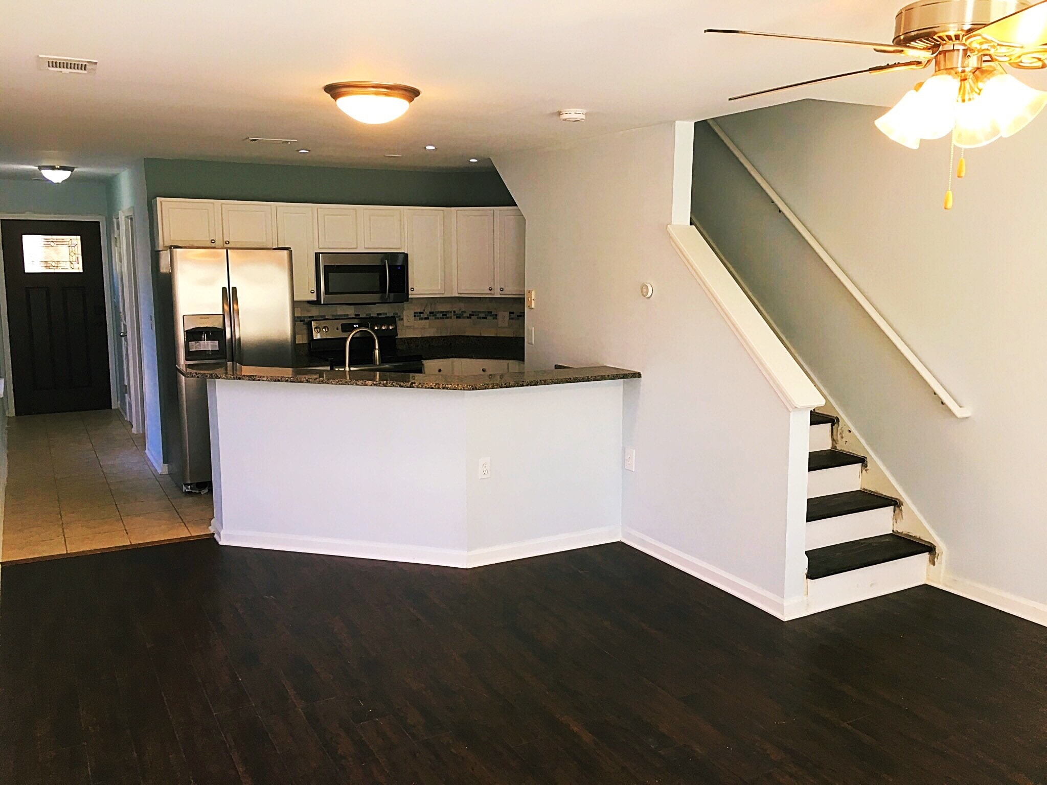 The kitchen and living room area. All brand new appliances, paint and flooring. - 190 Hutchinson St NE