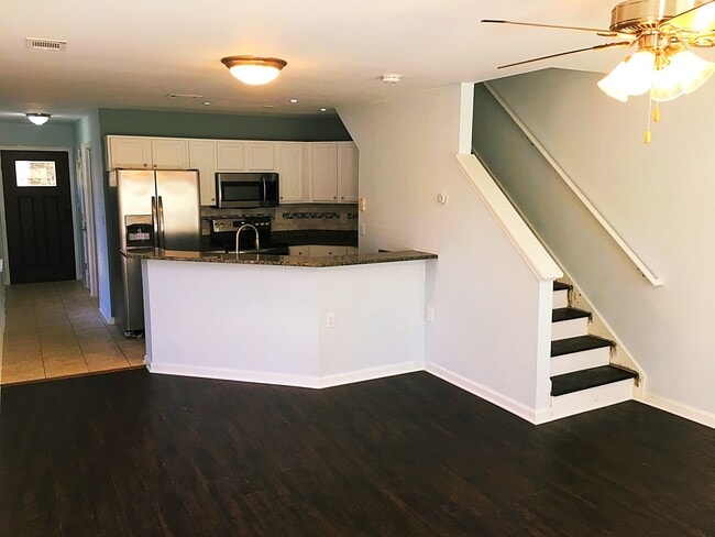 The kitchen and living room area. All brand new appliances, paint and flooring. - 190 Hutchinson St NE