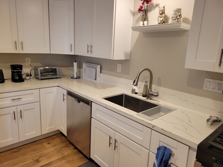 Kitchen has large sink @ garbage disposal, dishwasher, refrigerator and microwave. - 3673 Cherokee Ave