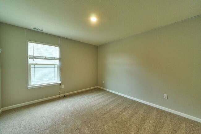 Building Photo - 4 Bedroom at Trotter's Landing in Camby With Pond View!